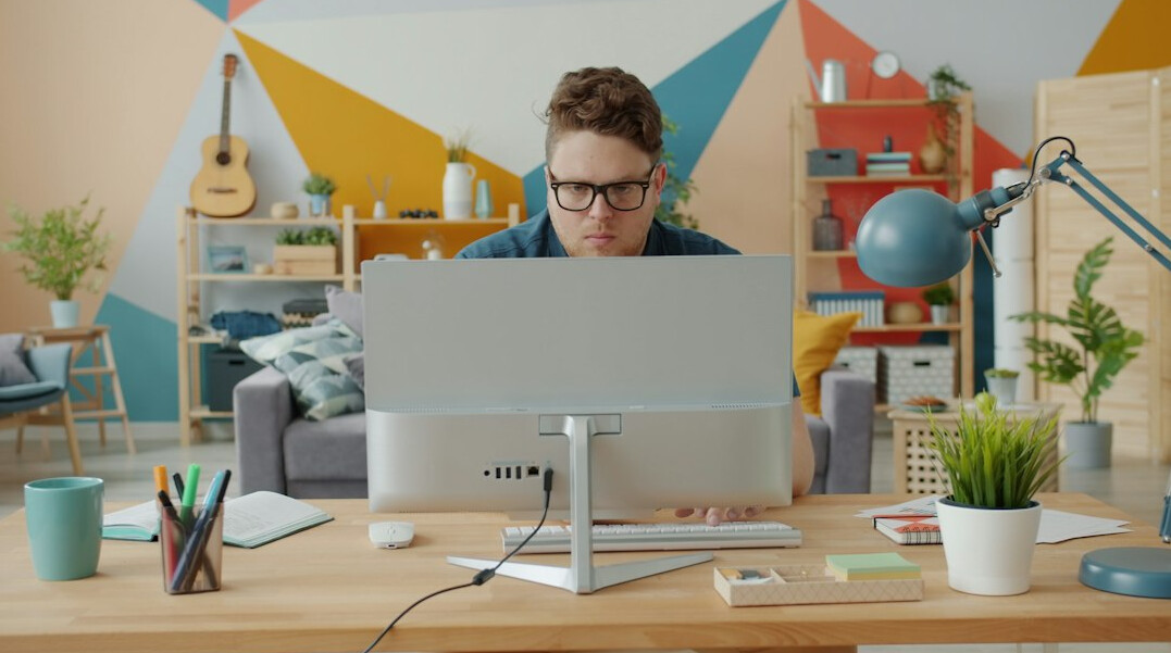 software developer coding at desk